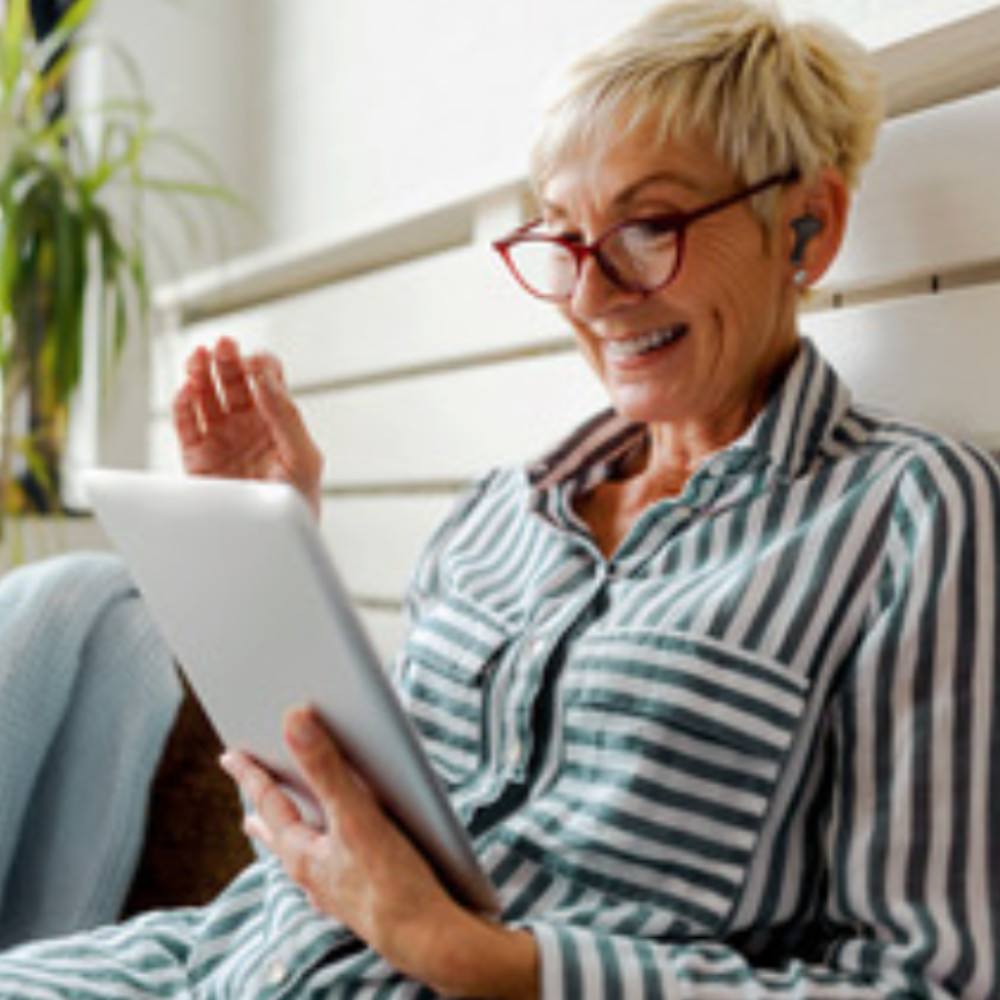 Audeara Buds - Woman on tablet